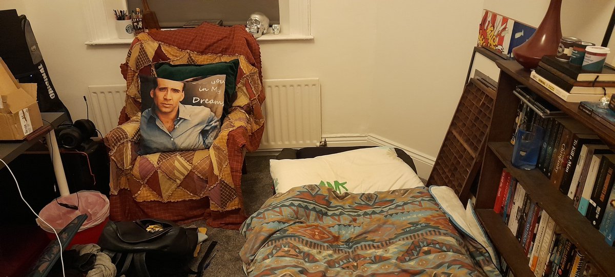 alicemarples's tweet photo. @rhodri Long time fan, first time submitting an entry for #duvetknowitschristmas - camp bed in brother's study feat. truly inexplicable Nic Cage cushion which reads 'See You In My Dreams' https://t.co/QWmHnzlFvq