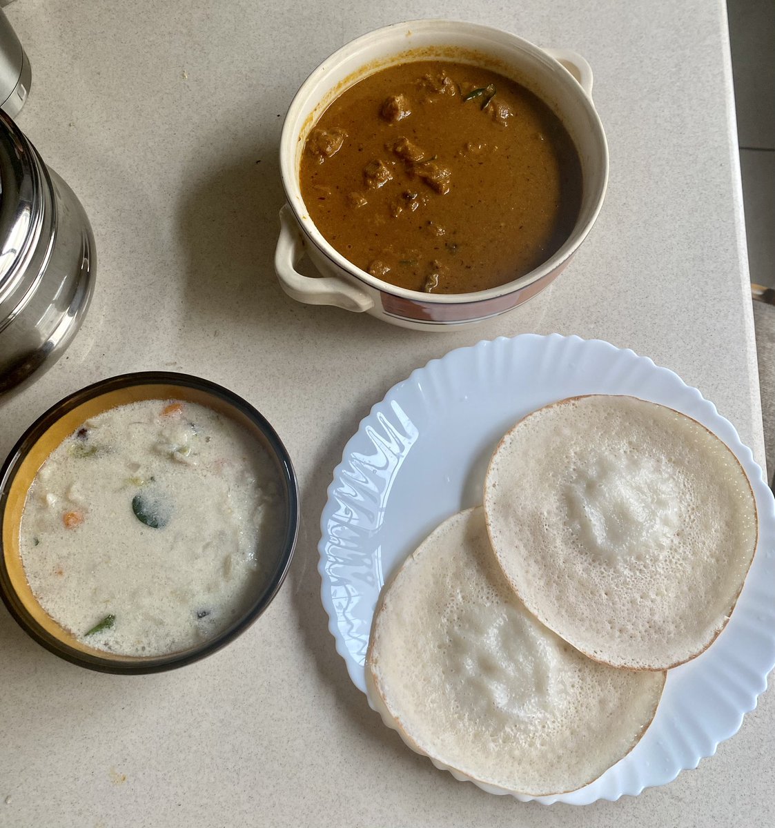 who_nisha's tweet photo. Christmas breakfast is usually Kozhi - Pidi. But since we had Pidi recently, had #Appam for breakfast. Had 2 curries: spicy Pepper #Chicken curry &amp; a non-meat #Potato #Ishtu Wishing everyone a blessed &amp; joyful #Christmas #Food #Breakfast #HomeMade #HomeCooking #HomeChef #TeamSoru https://t.co/ILUOUcWfPb