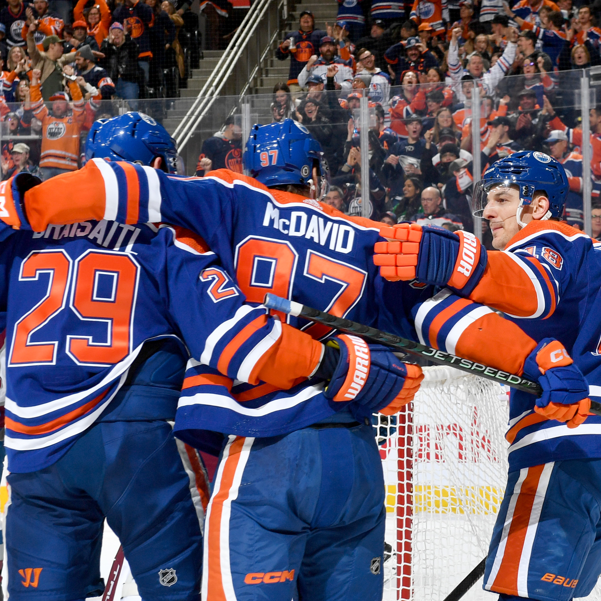 Draisaitl, McDavid and Hyman. celebrating a goal. 