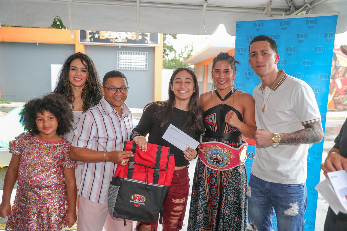 WorldBoxingOrg's tweet photo. 📷WBO belt ceremony and Christmas feast dedicated to the new WBO Jr. Flyweight World Champion Yokasta Valle at Monterrey Boxing Club, administrated by Emilio ‘Millo’ Lozada in Bayamón, Puerto Rico. https://t.co/JLNicNXoQZ