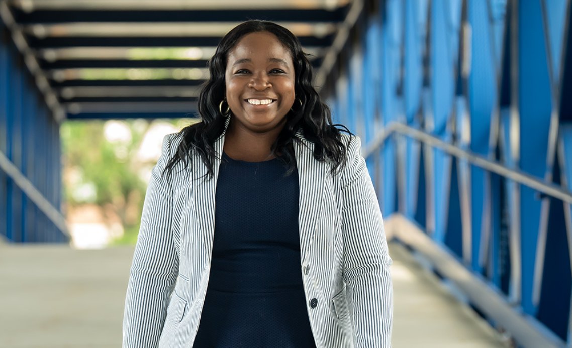 Janelle Harris, MSN ’17 at the blue bridge on La Salle University's campus.