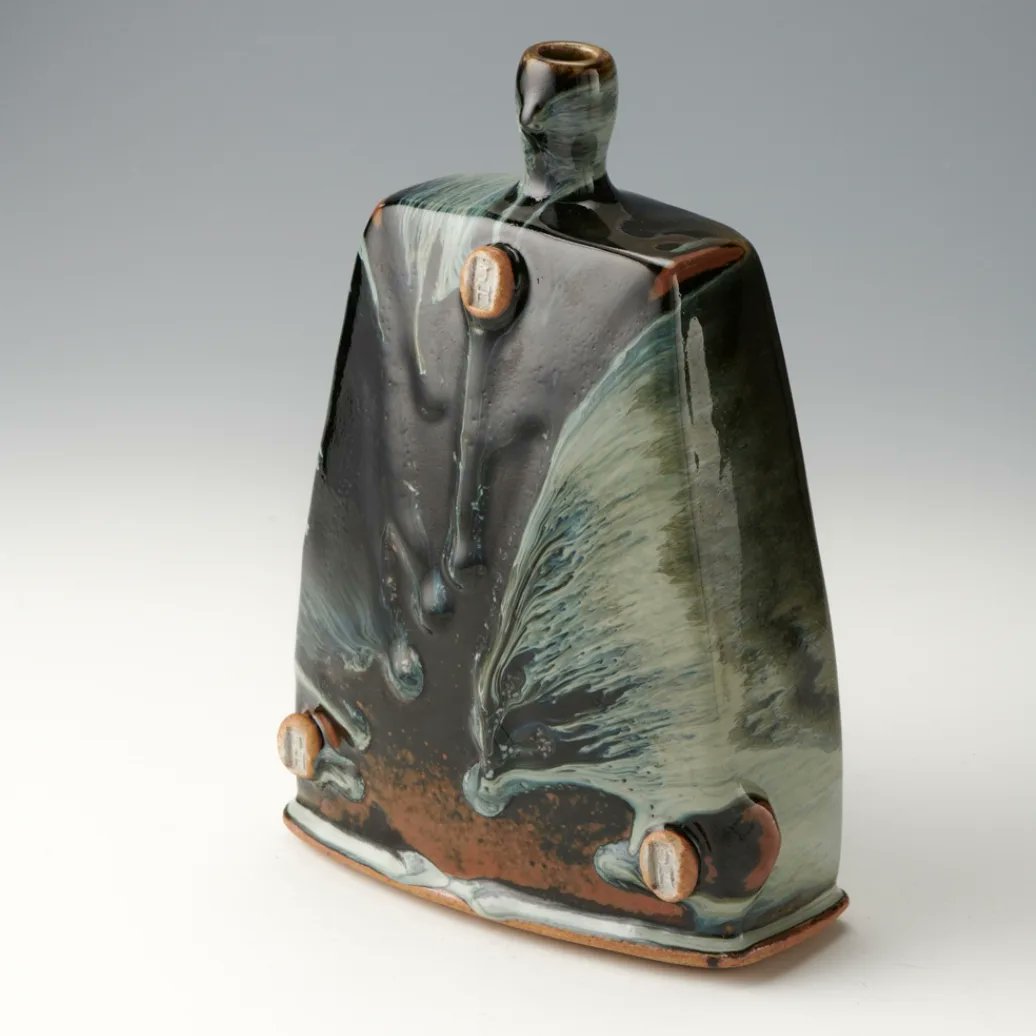 Thrown and altered Vase. 24cm tall 

Nuka and Tenmoku glazes in combination. Side fired. 

When I first started making these squared forms I wanted each face to be different. 

Which side is your favourite? 

#pottery #ceramics  #glazes