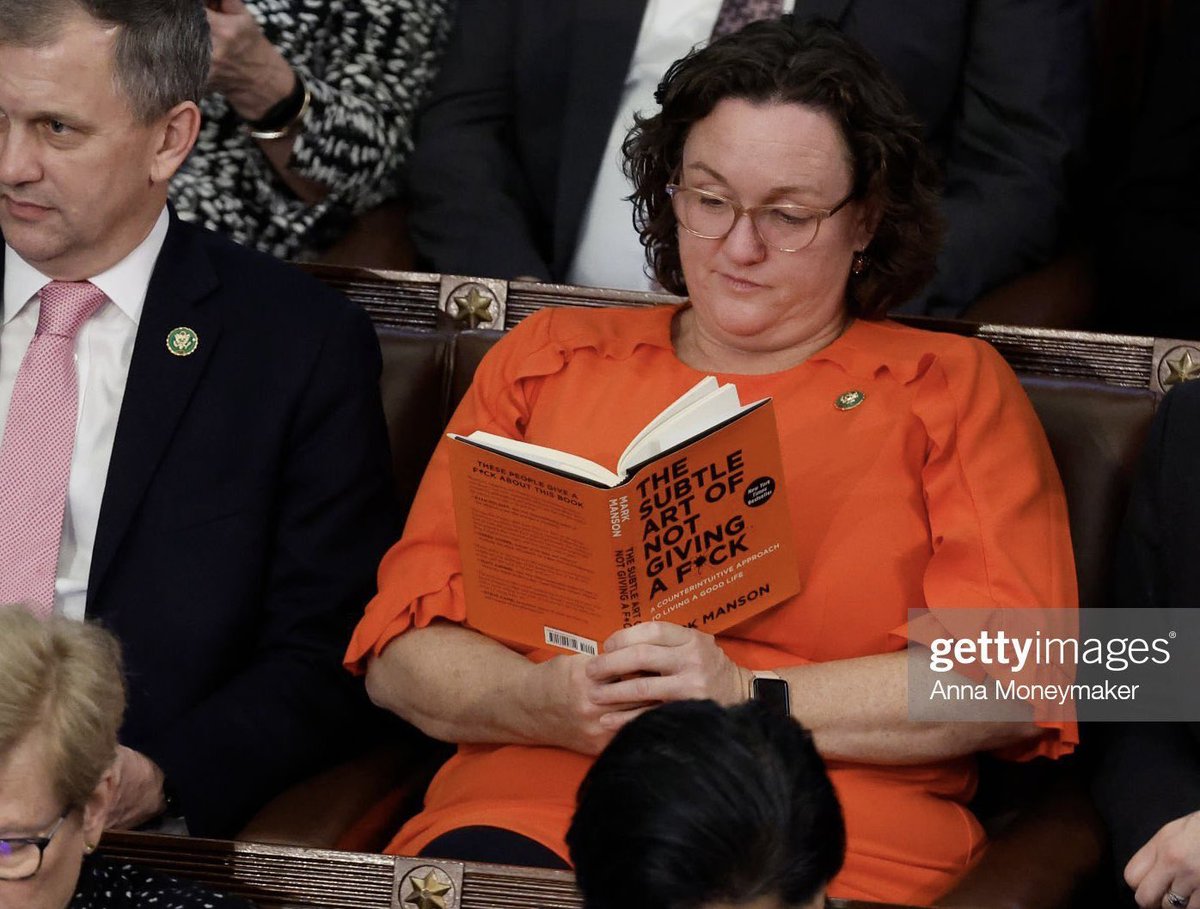 SYSCAbout's tweet photo. democrat @RepKatiePorter reading “the subtle art of not giving a fuck” in the chamber during the latest speaker vote is iconic https://t.co/R12pCYQRGm