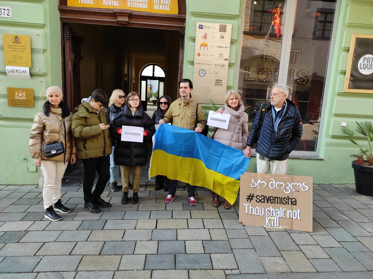 Standing with a group of people, small but unite, supporting M. Saakashvili, #SaveMisha, 
 at Georgian embassy in Bratislava.