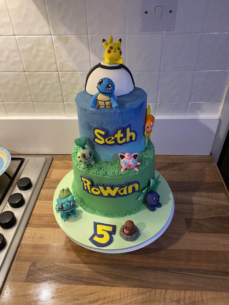 Amy__Turtle's tweet image. My kids asked me for a Pokémon cake that was a grass layer on the bottom, then a water layer, then a pokeball- with as many pokemon as I could manage. I did my best!