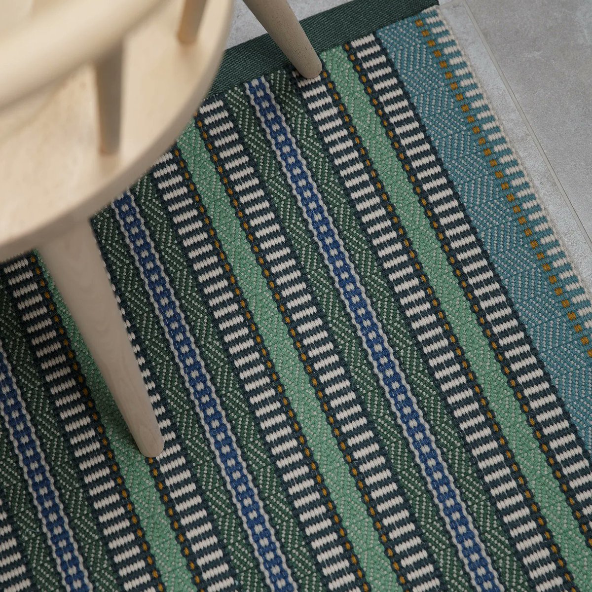 An intricate design using fresh greens and teal alongside elevating blue stripes, when joined by hand the highly patterned and complex body of Morella Emerald becomes the perfect choice for a statement-making flatweave rug. 

#RogerOates #TheArtOfFlatweave #AJourneyInColour