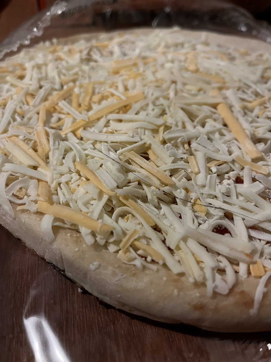 CatInTheTophat's tweet photo. @AldiUK just opened this pizza purchased today and it has a long dark hair on it. there goes pizza night 🤢 https://t.co/sab5xYk8vU