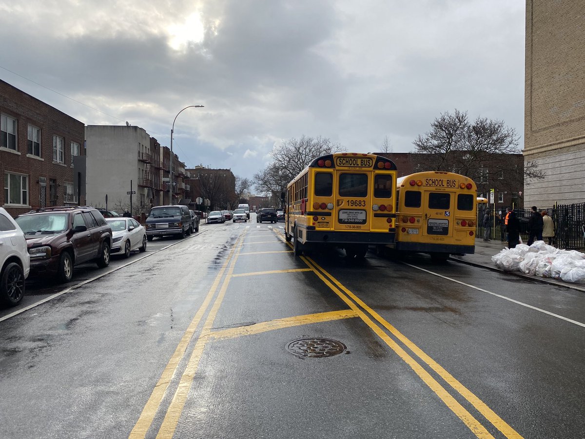 Jimithebug's tweet photo. @NYC_DOT Could we get stop signs placed on all corners in front of @psis226k, 23rd Ave &amp; 61st Street in Brooklyn? Parked busses hide the single stop sign on the right side &amp; drivers continue through intersection..only 61st street has double signs. @nyc311 https://t.co/ii5shcmqwZ