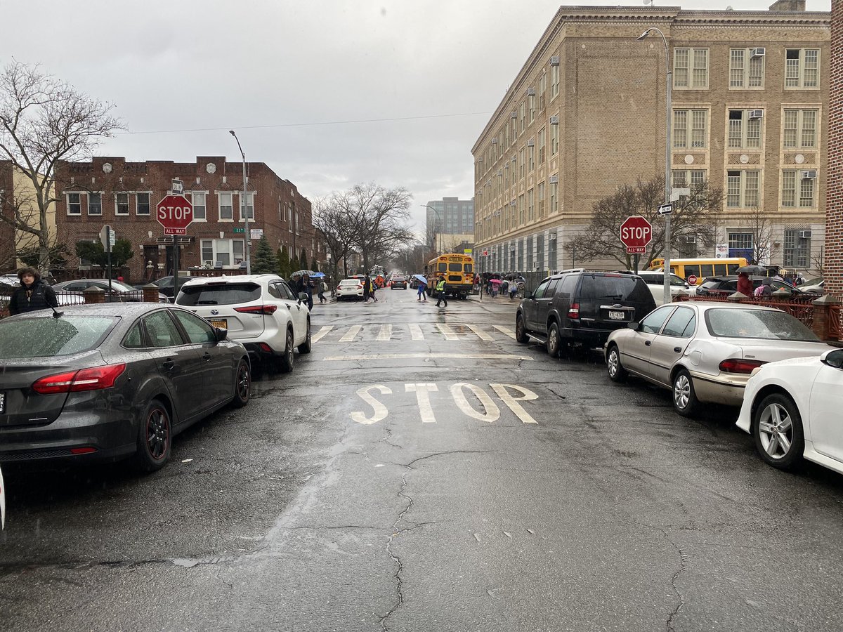 Jimithebug's tweet photo. @NYC_DOT Could we get stop signs placed on all corners in front of @psis226k, 23rd Ave &amp; 61st Street in Brooklyn? Parked busses hide the single stop sign on the right side &amp; drivers continue through intersection..only 61st street has double signs. @nyc311 https://t.co/ii5shcmqwZ