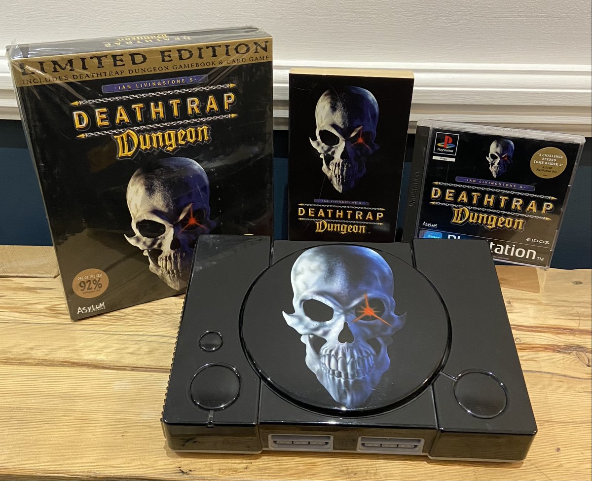 ian_livingstone's tweet photo. Look at the treasures I found in the loft including a personalised Deathtrap Dungeon PlayStation given to me in 1998. https://t.co/b4B3RhtVO0