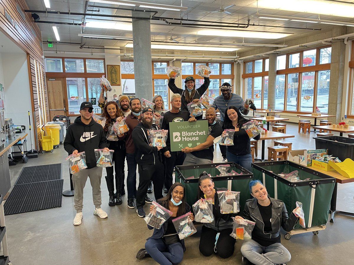 AEWTogether's tweet photo. Before last night’s sock drive, members of the @AEW roster headed in person to @blanchethouse 

They raced against each other to pack over 300 care kits to hand out to those in need! 

For more information on the incredible work they do visit https://t.co/4pnPQvZUrA https://t.co/6cQv7MvBrM