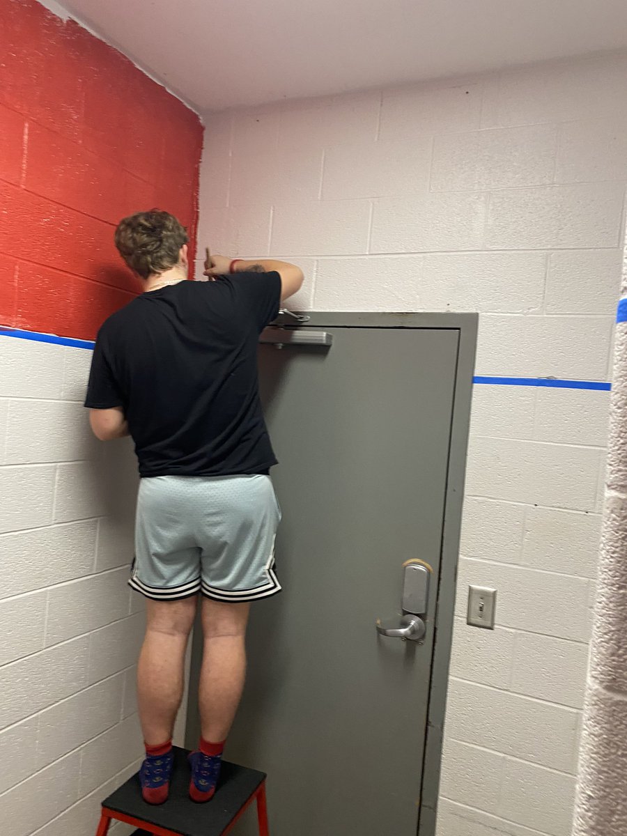 coachmoman's tweet photo. What did the boys do after a hard fought win?  Lifted weights, watched film, and started painting the locker room!  New year new locker room!  @LoganJ1001 @ZachRus63655573 @treyjohnston https://t.co/82AmzwDDyT
