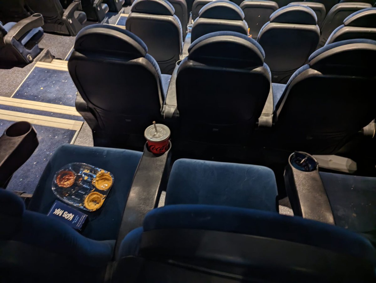 StopMoSteph's tweet photo. @ODEONCinemas #cardiffodeon Having paid nearly £30 for 2 cinema tickets, I feel like the least you can do is make sure the screens are clean. Multiple seats and floor coverd in food containers and junk. https://t.co/ooB4i9KsGW