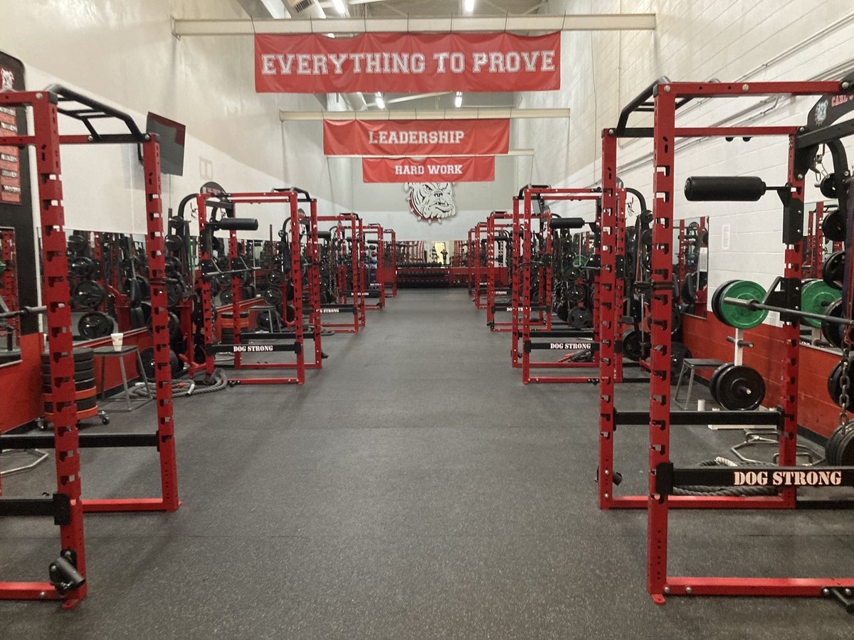 cjdogpower's tweet image. The room has been re set to allow better flow for our large number workouts!  Thanks to our graphic design class for our new stickers for the racks!  Time to get back after it and have a great second semester!  #dogstrong