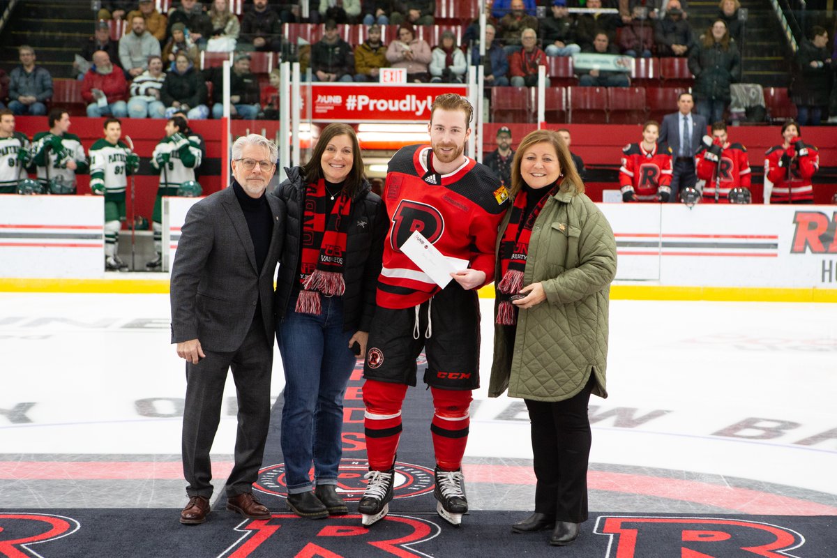 UNBAthletics's tweet photo. MHKY: Prior to Sat.'s @UNBMHockey game we celebrated the '22-'23 recipient of the prestigious Mark Jeffrey Memorial Scholarship... @bradygilmour9 
Mark's sisters, Jill Jeffrey &amp; Jane McEweon, were on hand to present, with Paul Simmonds of Robert Simmonds Clothing.
#goredsgo https://t.co/SUArNIybeT