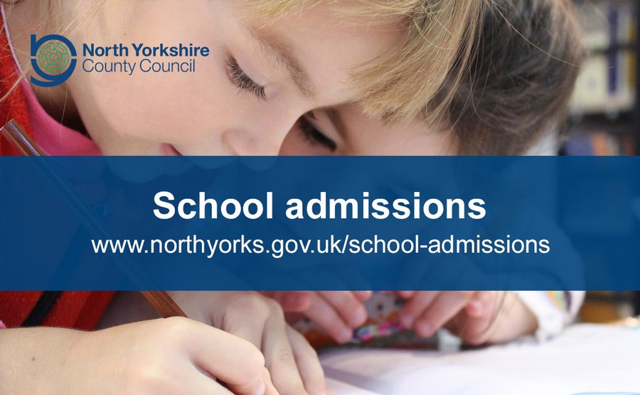 Two children writing with the primary school admissions link