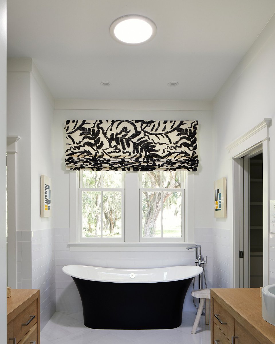 Happy #NationalBubbleBathDay. If you need us, we'll be enjoying a sunlit soak in our #freestandingtub, thanks to natural light from above. Learn how to brighten your bathroom with #skylights:bit.ly/3jW0RVe #SunTunnelSunday