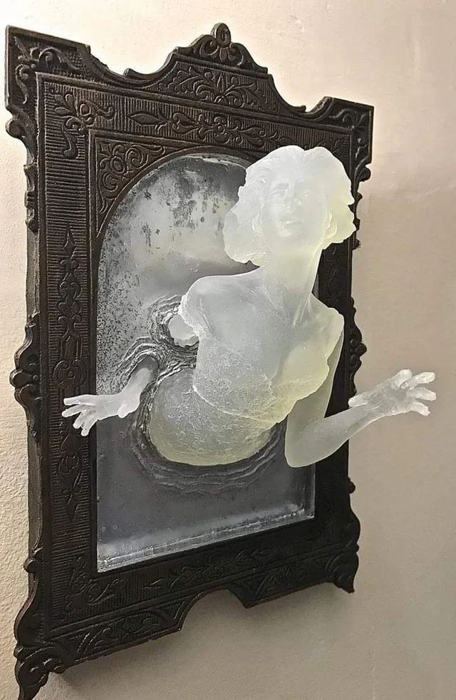 AcademiaAesthe1's tweet photo. Sculpture of a Victorian ghost emerging from an antique mirror cast in resin. https://t.co/fqeEQmi6O8