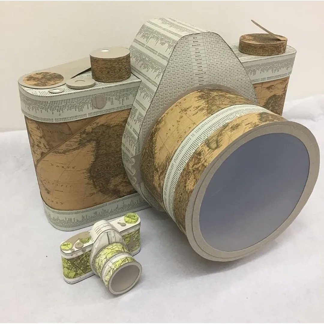 paperjennifer's tweet photo. I have been very lucky to work on some AMAZING projects over the years, like this GIANT ‘Map SLR Camera’ that went to Netherlands in 2018. This whopper was 4 times bigger than normal (pictured with my normal Paper Camera for scale) https://t.co/G9LtNfMo2n