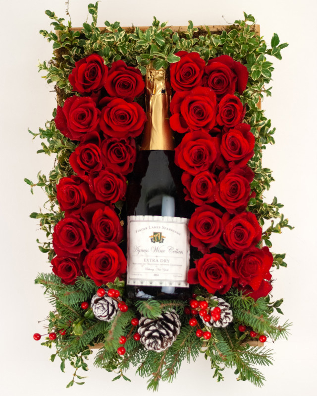 Finger Lakes Sparkling Wine nestled in a bed of 24 red roses, the perfect hostess gift for your New Year celebrations!

#HolidayCelebrationSparklingWine #RoseGiftPackage #newyearcelebrations #celebratewithRockcastle #florist #flowers
RockcastleFlorist.com