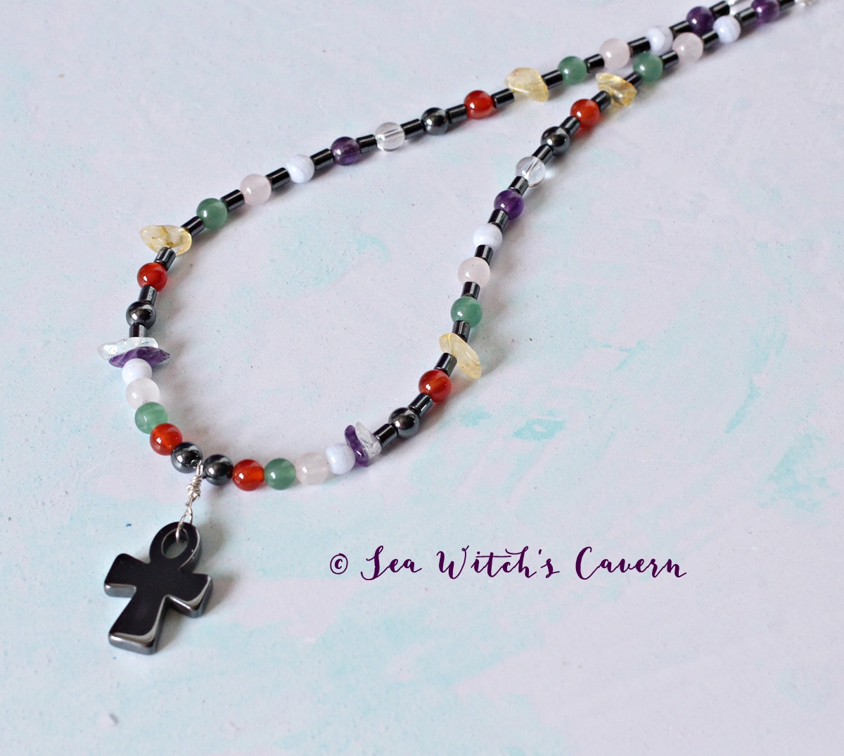 Colourful gemstone Chakra Necklace with hematite crystal Ankh, a  perfect necklace to balance your chakras with. 
etsy.me/2MhmybF  
#chakranecklace
#MHHSBD