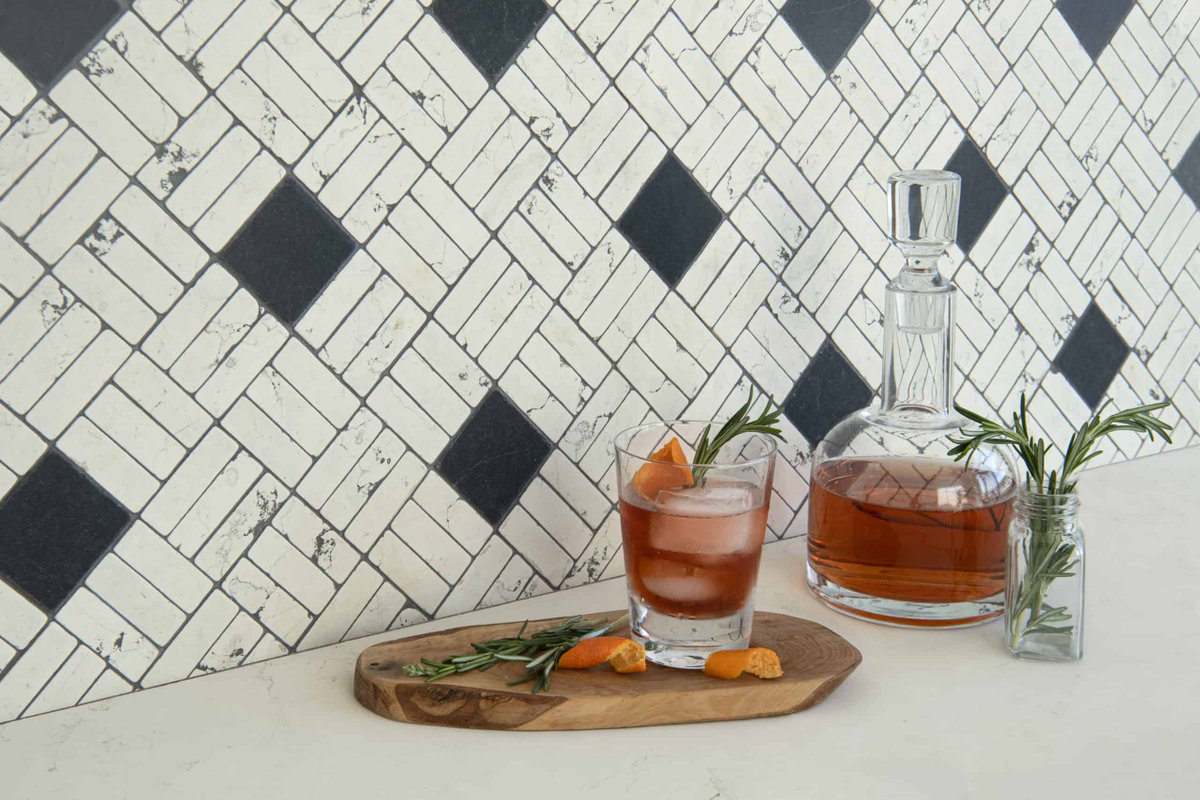 Cheers to making it over the mid-week hump 🥂 Oxford Weave, a hand-cut stone mosaic shown in tumbled Bianco Antico and Nero Marquina, is part our our newest collection, Heritage. #HumpDayHappiness #handcrafted #stone #Mosaic