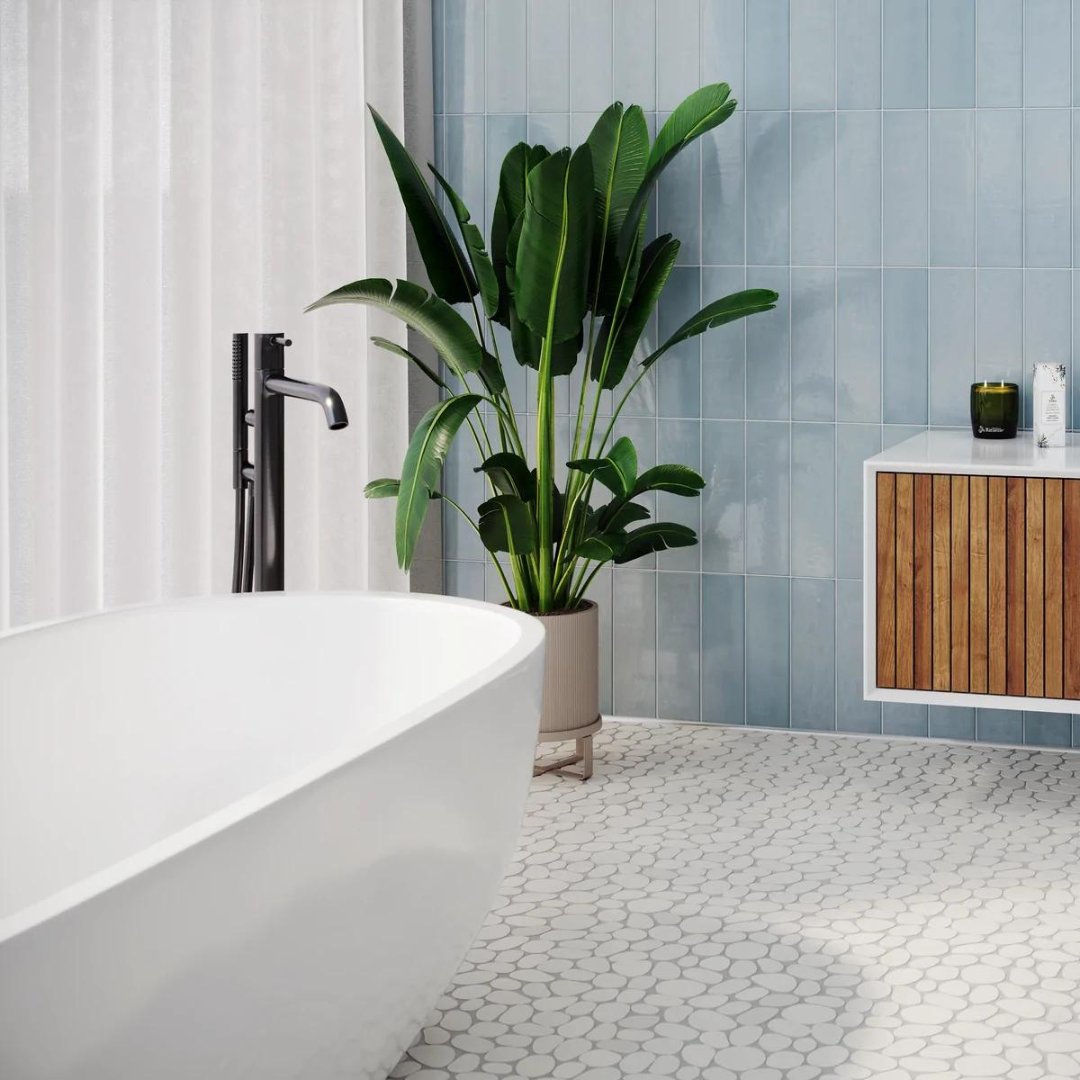 Featuring the stunning and classic look of mosaic, the Spindrift Marble tile is flat and comfortable in any space. In the Crystal White Honed color featured here, it brightens and elevates a room.

#islandstonetile #islandstone #tile #stone #mosaictile #mosaic #renovation