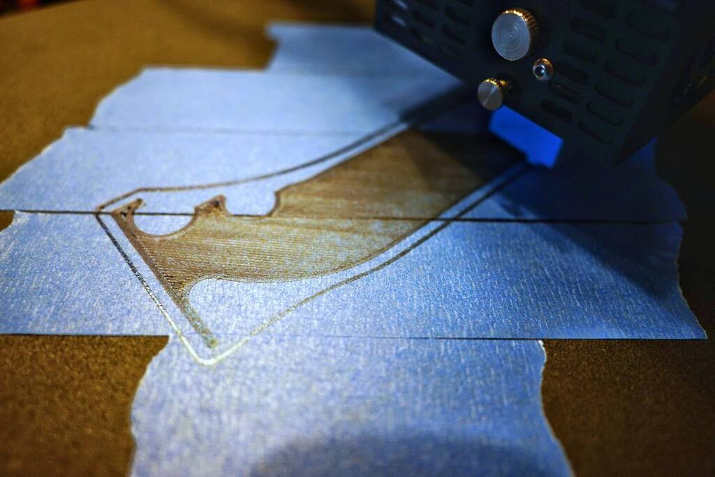 NickDrudge's tweet photo. Sure, my print bed isn’t level, but it looks like I’m running the head into the tape instead of the bed, so I’ll let it go. https://t.co/5XZ8FJotZe