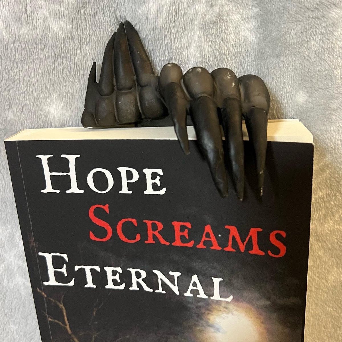LaConteuse's tweet photo. Walter is the inspiration for my short story “Hope Rekindled” in HOPE SCREAMS ETERNAL. He’s here to show off my new #monster claw #bookmark! 📚😱 #book #Reading #horror #claws #dolls #ventriloquist #indiepub @UnsettlingReads #shortstory #unsettlingreads https://t.co/oc5uQrO6bU
