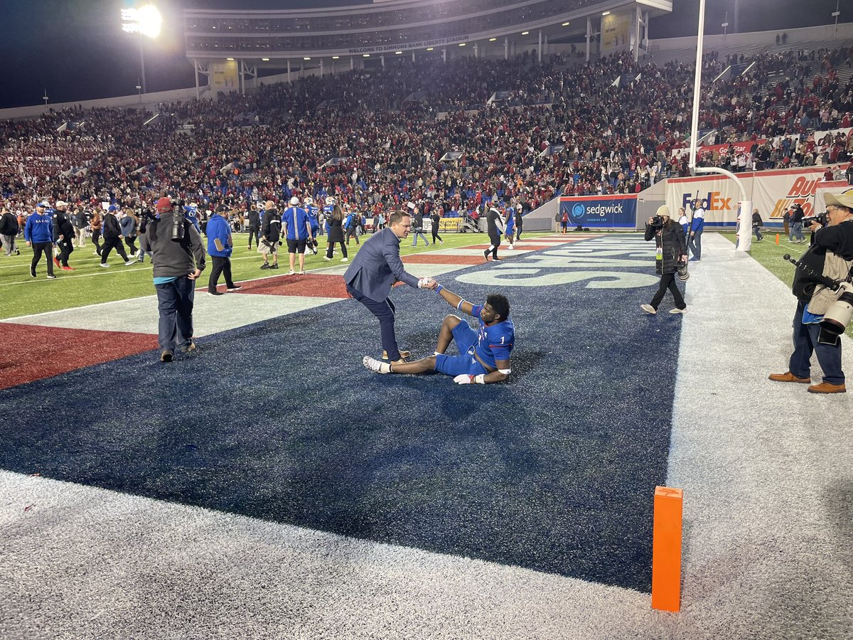 MSwain247's tweet image. Kansas AD Travis Goff helps Kenny Logan get up just after the final play of the game. #KUfball