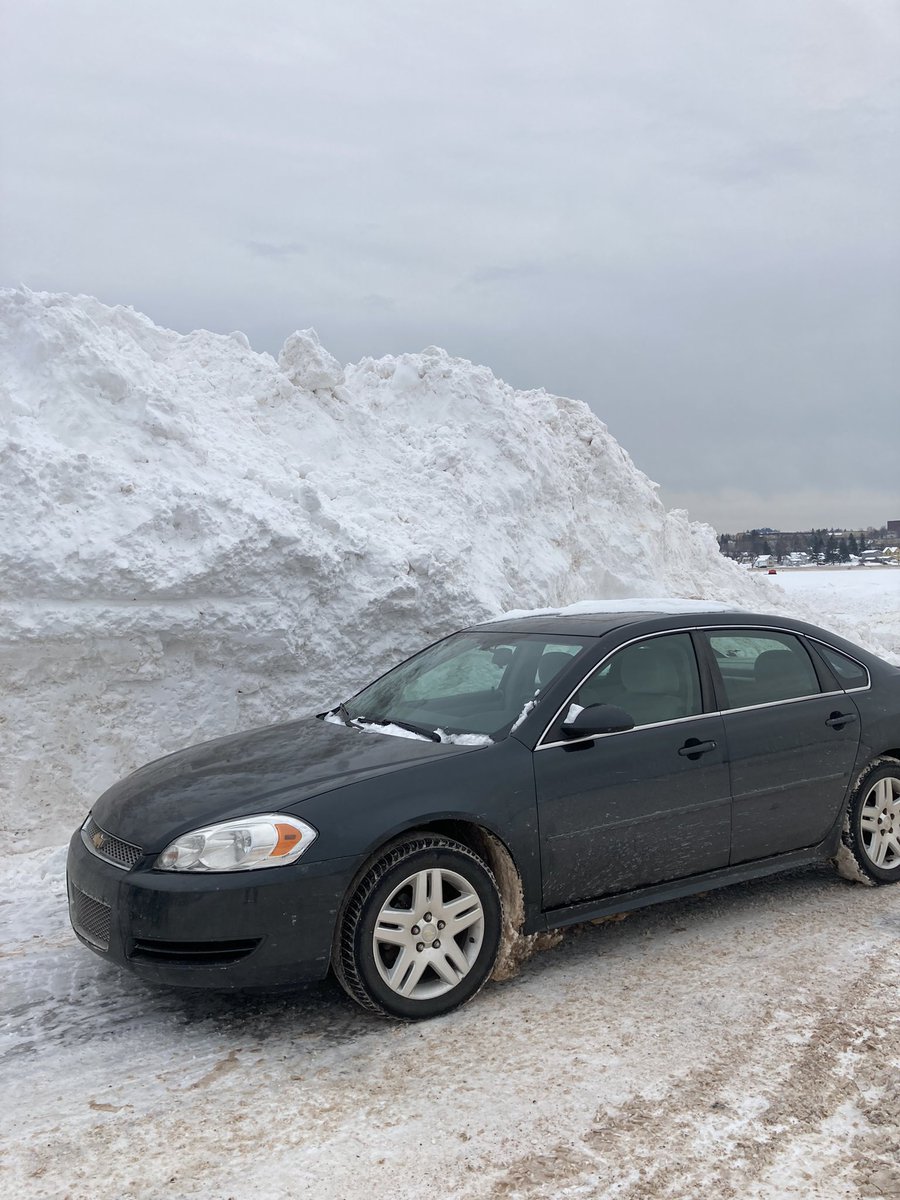 wolverinesrock's tweet photo. Check out this snowbank I parked next to today. It’s from the Christmas storm #UPLife https://t.co/fM6DGm1TFR