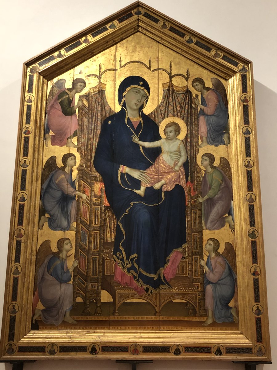 nasserrabbat's tweet photo. One of the oldest Arabized #pseudoscript I found is this 1285 painted wooden panel of the Madonna & Child with Angels by Duccio di Boninsegna from Siena. The pseudo letters-appear on the angels' armbands, the curtain header and the cushion's hem behind the Madonna. At the Uffizi. https://t.co/vhjU3suNmj