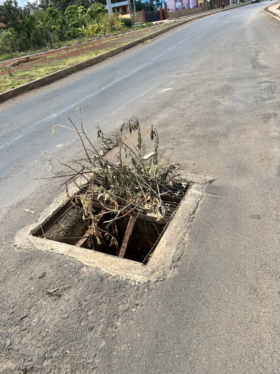 daktari1's tweet image. This is Langata road towards Karen near Waterfront and this drain has been open for months marked with twigs - we are waiting for an accident to happen, a life to be lost needlessly and then we hurriedly repair @KURAroads @Ma3Route @@ntsa_kenya
