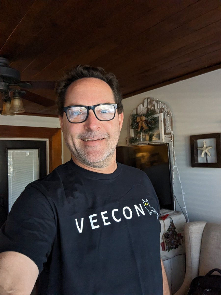 busterlevin's tweet photo. Sporting my @veecon shirt I earned from @Corso52 helping out on crowd control at the merch table as a volunteer. Kindness is the Key! It was awesome to get an inside look at my investment in @veefriends 😁💜🥷 @garyvee @dustynotjusty @zaingaziani #TenaciousB https://t.co/b5pOnNEXT2