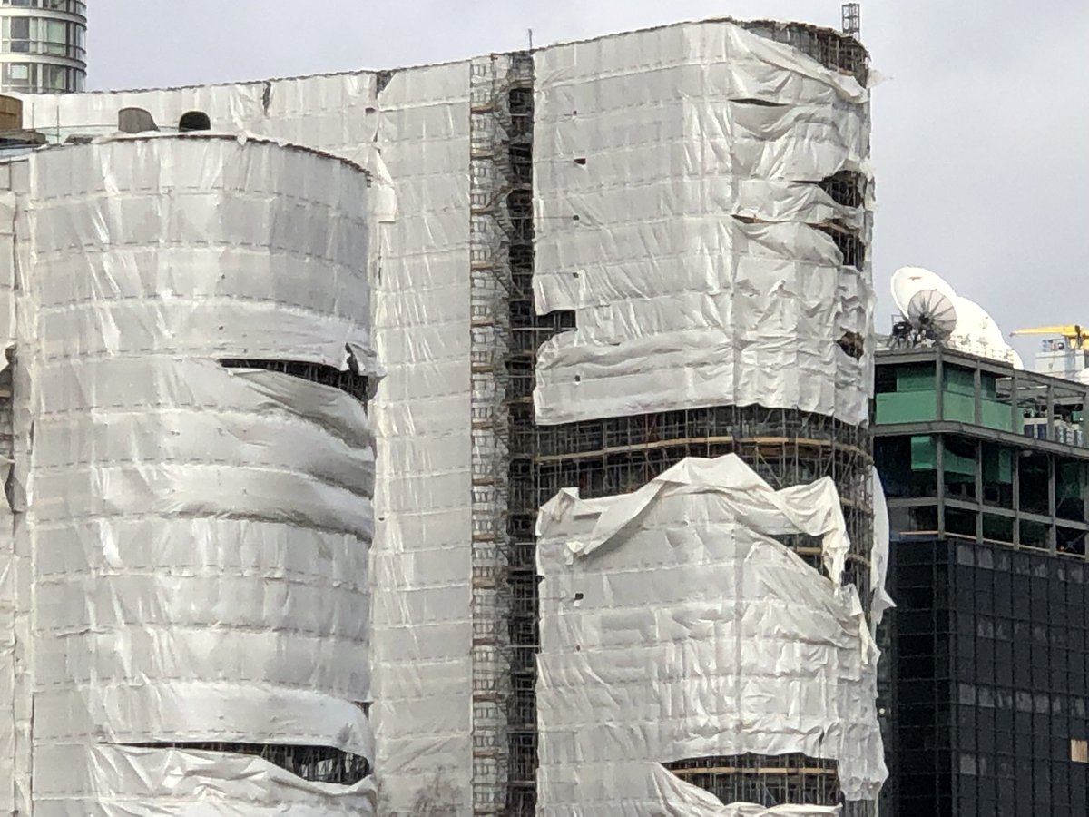 nat77splat's tweet photo. Note where wind has pulled ‘weatherproof’ #Monarflex from the building. Designed that way apparently to prevent acting as a sail #StormEunice shredded ours & then miraculously the absolute indisputable need disappeared & netting went up instead #BanMonarflex on occupied buildings https://t.co/1k7xd2lfR0