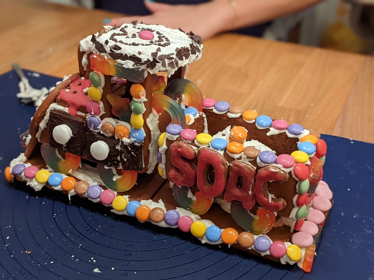 sdac_fau's tweet photo. Yesterday, four SDACers got together to make a gingerbread train! This train looks quite unusual, but symbolizes very much the spirit of our program. We´re rushing, like this train, into the new year 2023 and wish you happy holidays!
#NewYear2023 #SDAC https://t.co/kcC0fpO6VX