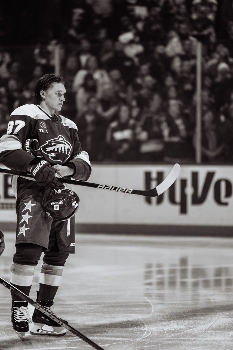 JamesMurrayECH's tweet photo. Quick shoutout to a friend of mine @schmidtyphoto for taking what is, in my opinion, the photo of the year in the @NHL . Pretty cool to see how far you’ve come over the years. Gotta think 97 is gonna have a tough time not posting this to his Instagram! #kaprizov #mnwild https://t.co/GJYaO8fbkq