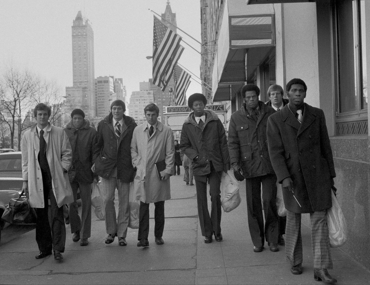 IUArtifacts's tweet photo. The Hoosiers walking down 59th St. and Central Park South in route to the NY Athletic Club for practice the morning of December 29, 1975. IU would take on (&amp; defeat) St. John’s that evening in the final of the Holiday Classic. The most iconic photo in IU basketball history. #iubb https://t.co/NKH3pklcHw