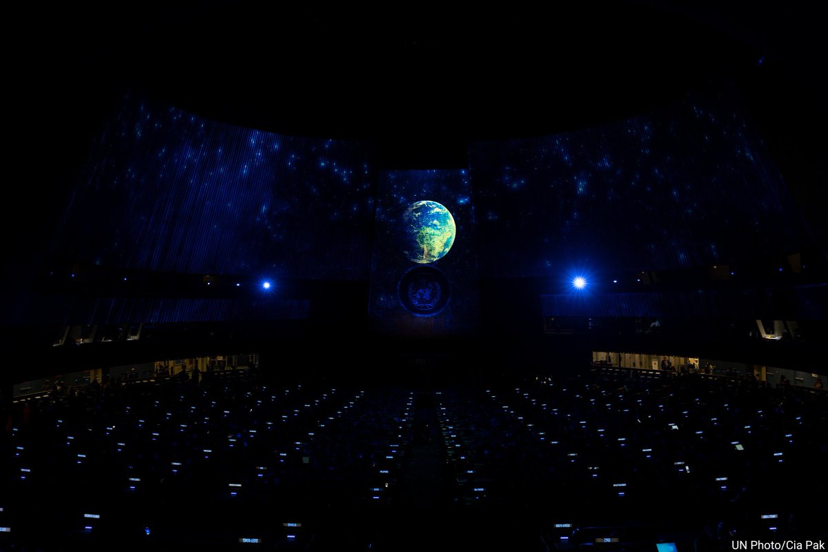UN's tweet photo. #YearInReview: The promise of the #GlobalGoals illuminated #UNGA hall during this year's SDG Moment with world leaders & more.
The special event highlighted the importance of global action for a better future for all. https://t.co/Ss4uMcXdcV https://t.co/oK25dMYgXP