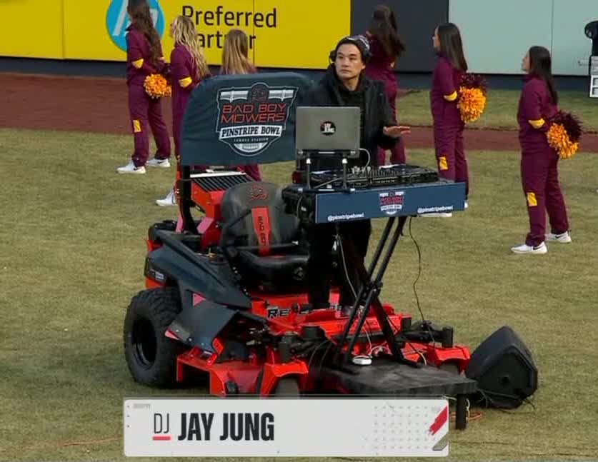 BleacherReport's tweet photo. He's DJing on a lawn mower❓ https://t.co/s5Z7mJsh3L