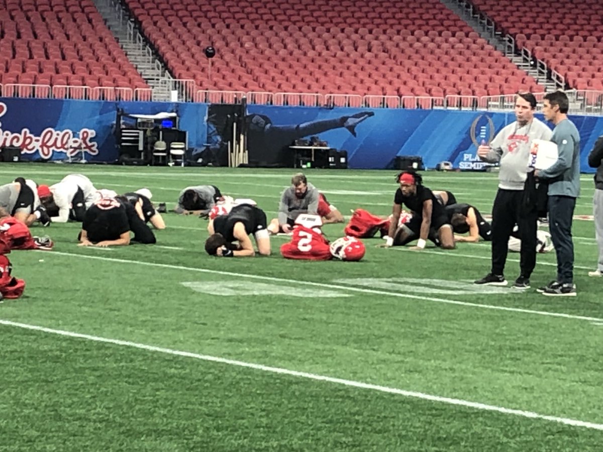marcweiszer's tweet photo. Kirby Smart is taking part in yoga but appears to be on his cell phone https://t.co/ZbsgzP9DoZ