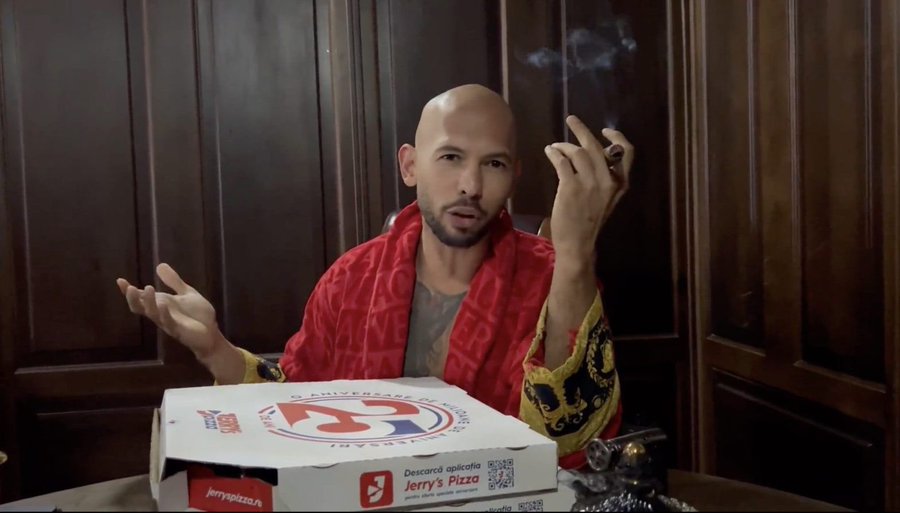 lahariya_boby's tweet photo. Andrew Tate reportedly inadvertently tipped off Romanian authorities of his presence in Romania with his response video to Greta Thunberg.

The pizza boxes shown in the video are from Romanian chain Jerry’s Pizza. https://t.co/cYcsd0fipy