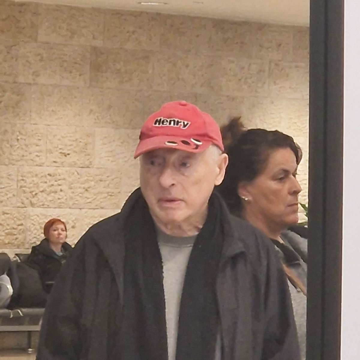 David_Rudnick's tweet photo. guy in the airport has a henry hat like the hoover. insanely sick, probably hardest drip i've seen all 2022 https://t.co/463Z2GemtN