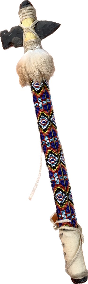 Tomahawk I made for my sister . Flint from England,Acacia tree branch, glass beads around the handle, rawhide grasp , Apache, tears on both ends and rabbit fur . #flintknapping