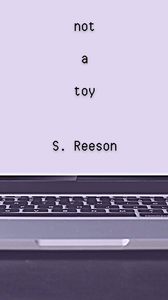 The cover of my 2023 digital chapbook, NOT A TOY. These words are seen on the screen of a Laptop, shown in close-up.