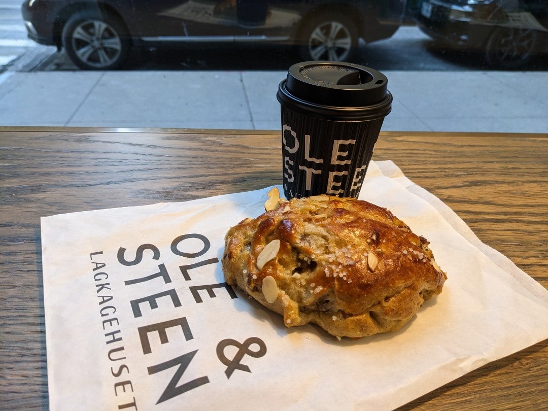 Morning coffee and Danish pastry to start the day. Kloben Bun.  Soft bun, cardamom, raisins, almonds, sugar. Americano. Pretty good pastry. (@ Ole &amp; Steen - <a href="/oleandsteenus/">Ole & Steen US</a> in New York, NY) swarmapp.com/c/0S0K6nERffb