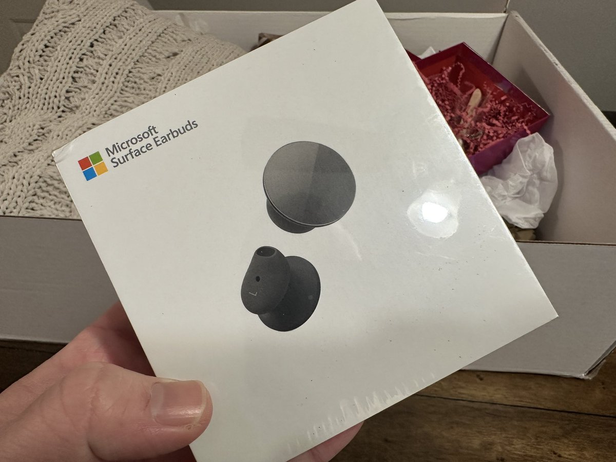 AdamJMatlock's tweet photo. A super cool Christmas gift from the fine folks over at @surface! Very cool. I always wanted to try out the Surface Buds! Also, I really love this quilt! Thank you. #10YearsOfSurface #Surface #Microsoft https://t.co/XjFrY1mPa0