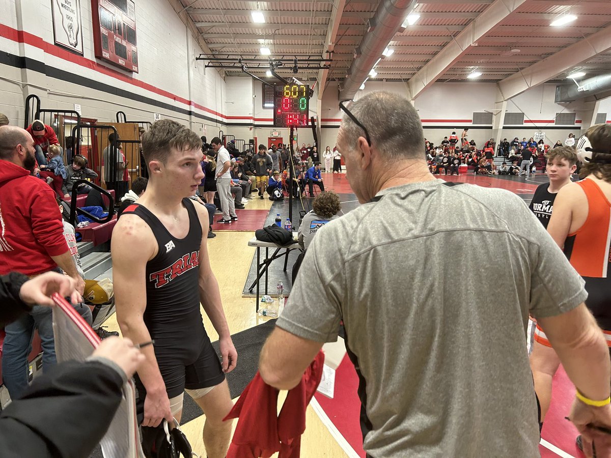 TriadKnights's tweet photo. Coach Witzig giving some coaching tips and I’m sure life lessons to Landon Lynn! @THS_WrestleX2S @TriadHighSchool #singleleg #grapplin https://t.co/Hs22PS9G9g