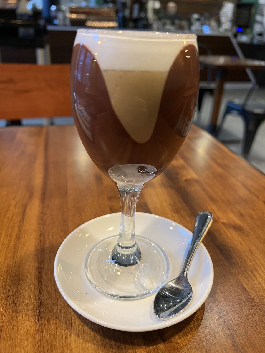 JKenstowicz's tweet photo. This is a Bicerin, which I’ve never heard of before. Layers of sweet cream, espresso, and chocolate. BTW, this is not a decorative glass; it’s chocolate lining. https://t.co/c7iV4UuOPq
