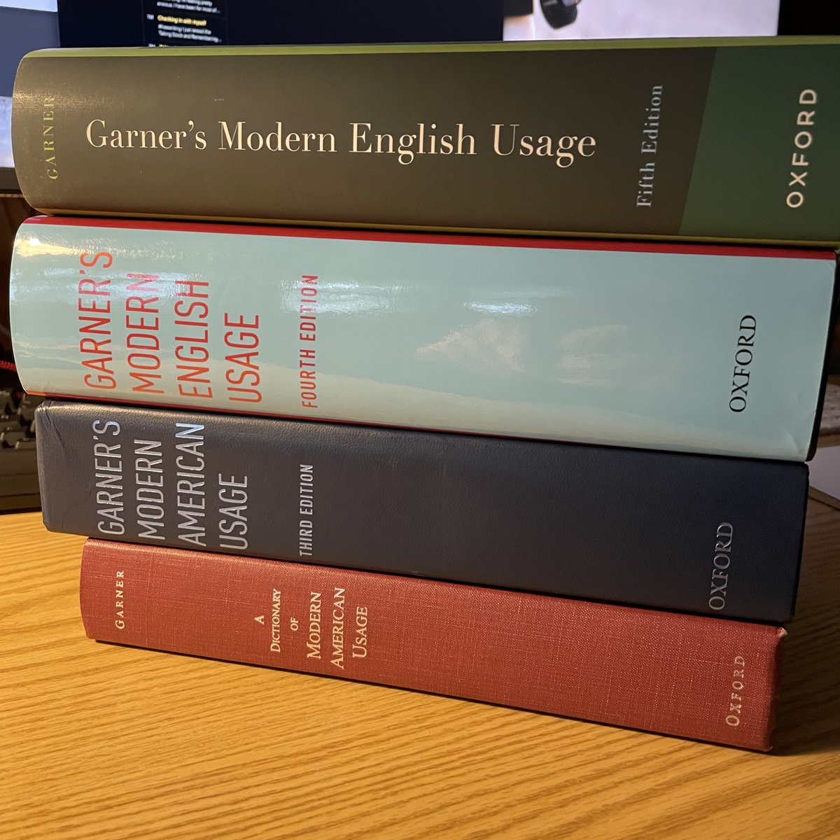 Four of five editions of <a href="/BryanAGarner/">Bryan A. Garner</a>’s usage dictionary. The missing second edition came out while I was in grad school—and grad school finances meant having to sit that one out.
